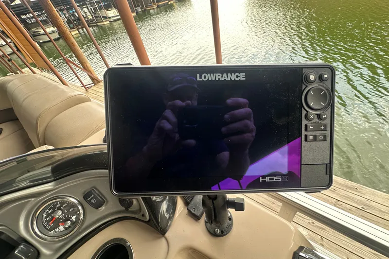 Slide: The Image of Lowrance HDS9 fishfinder on 2019 SunCatcher SF 22 XP3 boat, docked by the water. - 22
