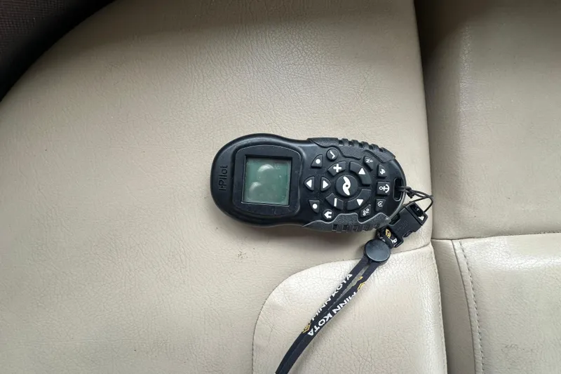 Slide: The Image of Remote control on beige leather seat, SunCatcher SF 22 XP3, 2019 model. - 24