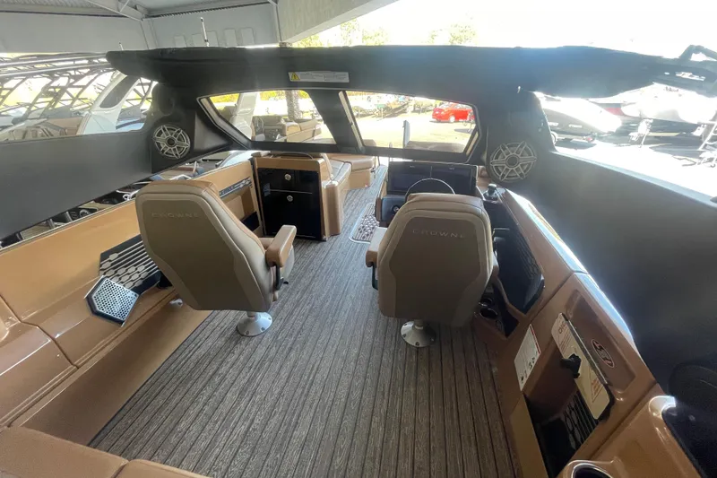 Slide: The Image of Interior of 2026 Harris Crowne SL 250 boat with modern seating and controls. - 13