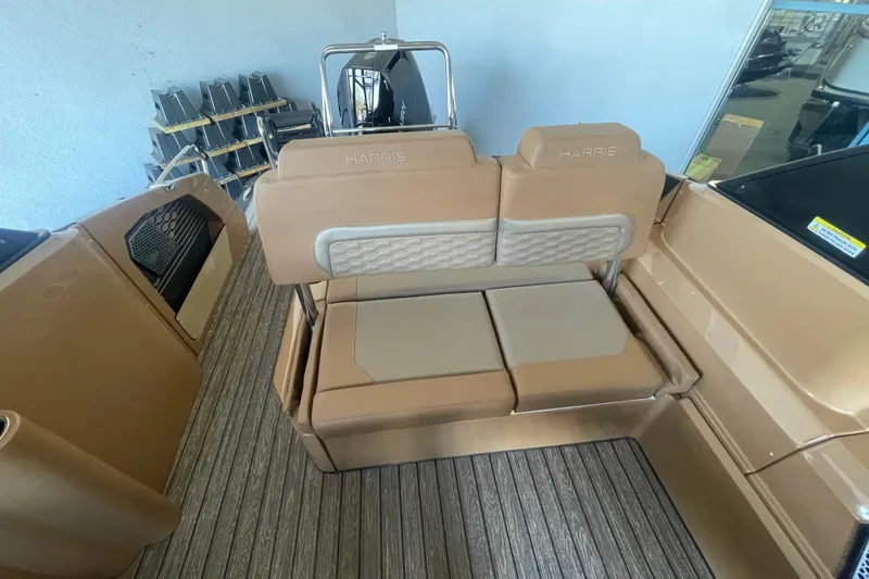 Slide: The Image of 2026 Harris Crowne SL 250 boat interior with tan seating and sleek design. - 14