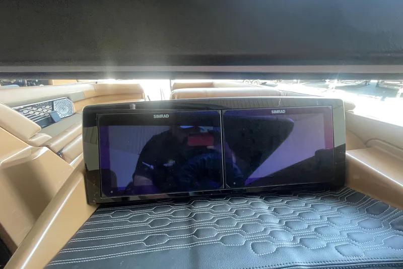 Slide: The Image of 2026 Harris Crowne SL 250 interior with dual Simrad displays and luxurious seating. - 15