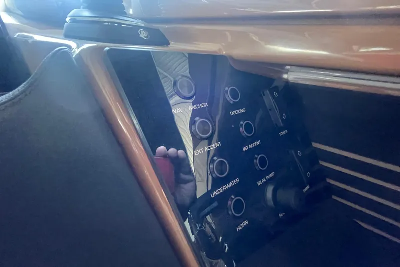 Slide: The Image of Control panel of 2026 Harris Crowne SL 250 boat with various function buttons. - 16