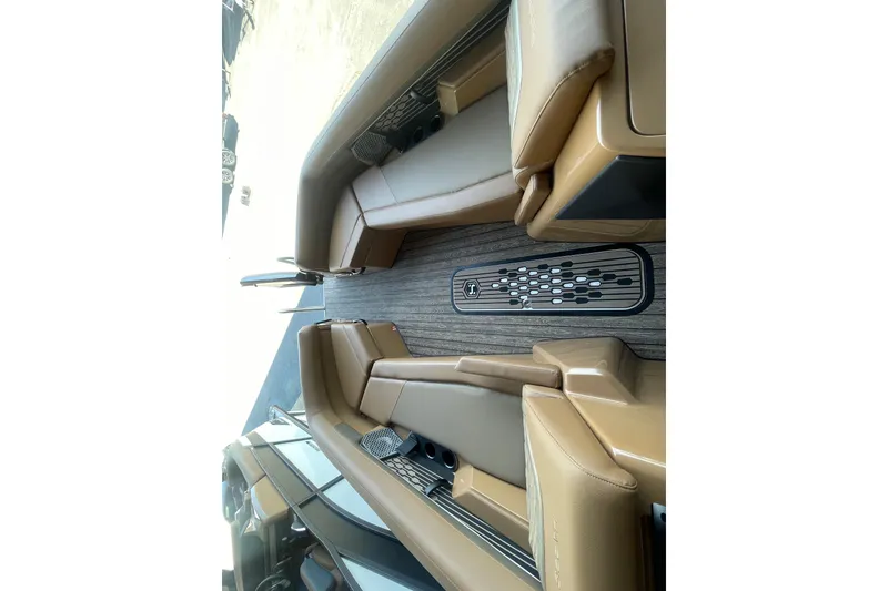 Slide: The Image of Luxurious interior of 2026 Harris Crowne SL 250 boat with tan seating and sleek design. - 17