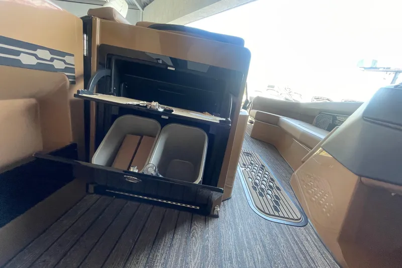 Slide: The Image of 2026 Harris Crowne SL 250 interior with open storage compartment and seating area. - 19