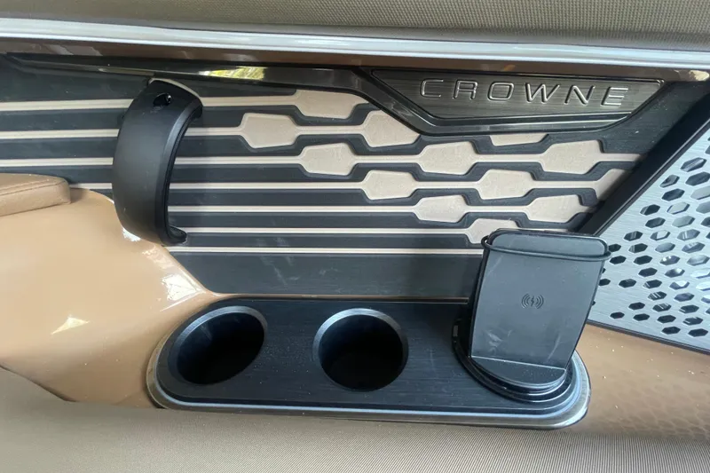 Slide: The Image of Interior of 2026 Harris Crowne SL 250 with cup holders and phone dock. - 21