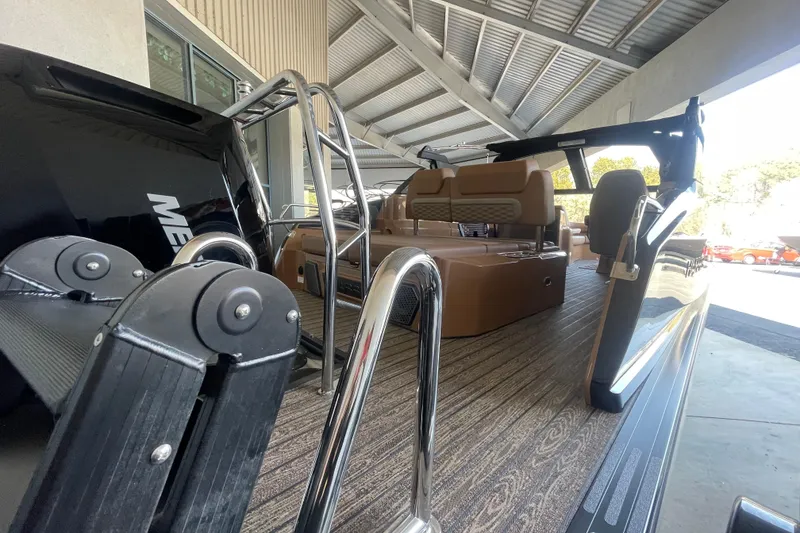 Slide: The Image of 2026 Harris Crowne SL 250 pontoon boat with luxurious seating and modern design. - 8