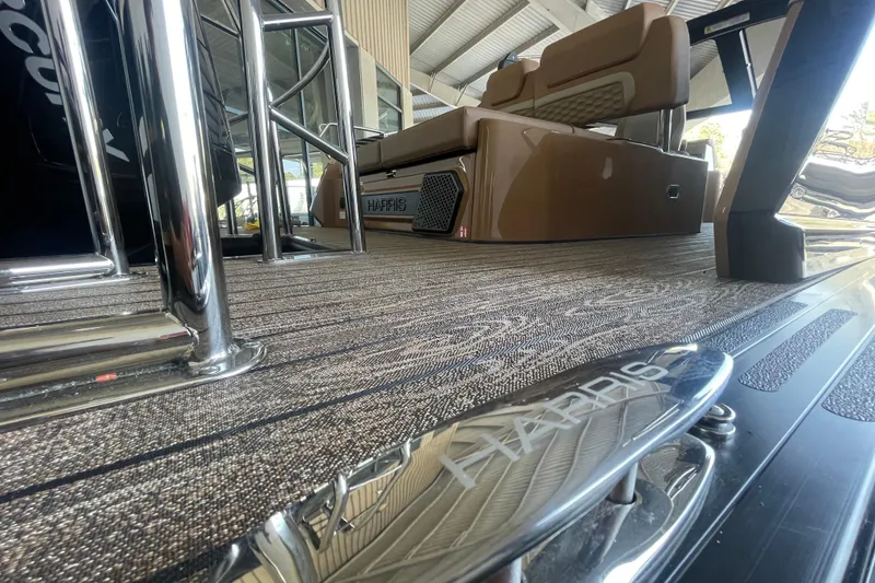 Slide: The Image of 2026 Harris Crowne SL 250 boat interior with sleek seating and modern design elements. - 9