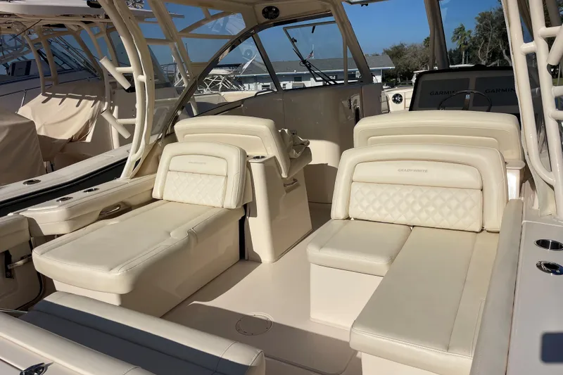 Slide: The Image of 2019 Grady-White Freedom 325 boat interior with luxurious beige seating and modern design. - 12