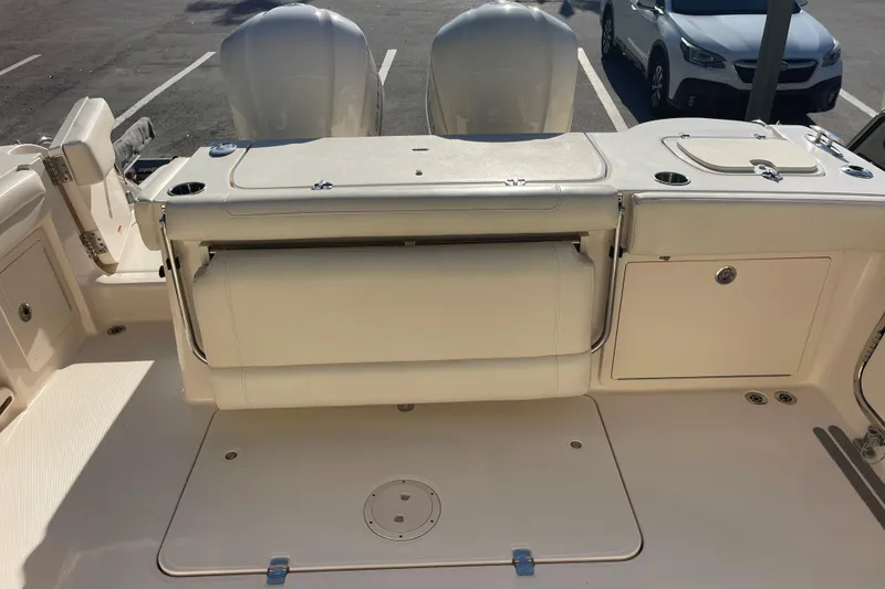 Slide: The Image of 2019 Grady-White Freedom 325 boat interior with seating and storage compartments. - 15