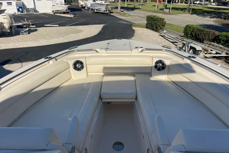 Slide: The Image of 2019 Grady-White Freedom 325 boat interior with spacious seating and speakers. - 18