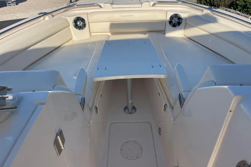 Slide: The Image of 2019 Grady-White Freedom 325 boat interior with seating and table setup. - 19
