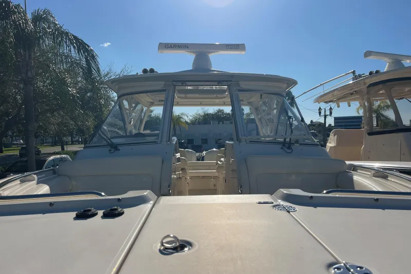 Slide: The Image of 2019 Grady-White Freedom 325 boat docked under clear blue sky. - 22