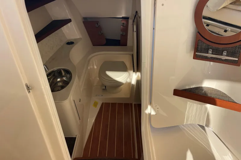 Slide: The Image of 2019 Grady-White Freedom 325 boat interior with toilet and sink. - 23