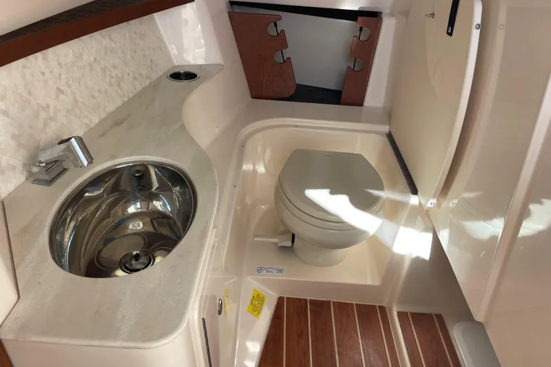 Slide: The Image of 2019 Grady-White Freedom 325 boat interior with sink and toilet. - 24