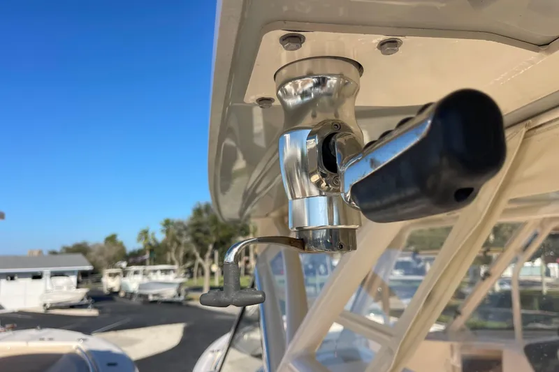 Slide: The Image of Close-up of a 2019 Grady-White Freedom 325 boat's control handle. - 26
