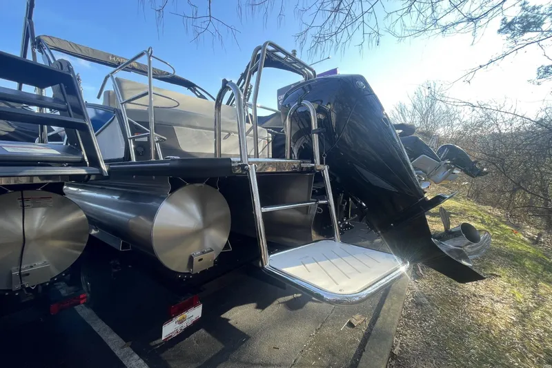 Slide: The Image of 2026 Harris Sunliner 230 pontoon boat with outboard motor and stainless steel ladder. - 10