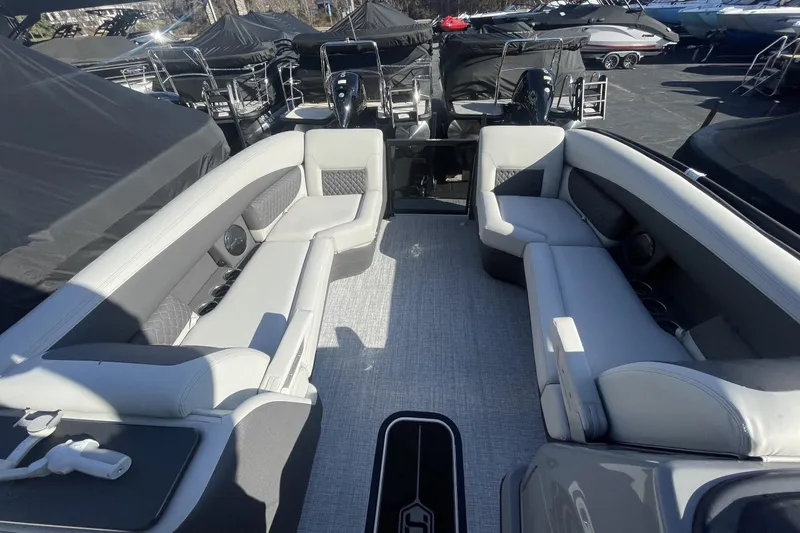Slide: The Image of 2026 Harris Sunliner 230 pontoon boat interior with luxurious seating and modern design. - 14