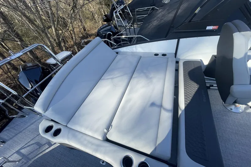 Slide: The Image of 2026 Harris Sunliner 230 boat interior with comfortable seating and cup holders. - 22