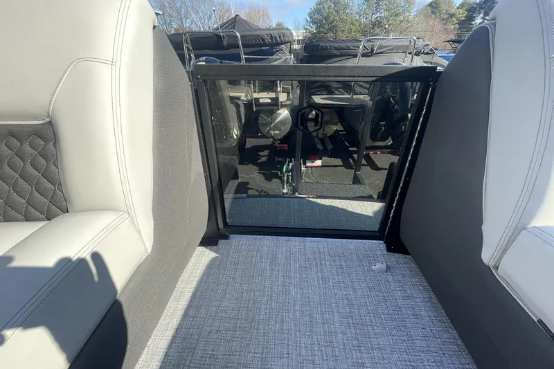 Slide: The Image of Interior view of 2026 Harris Sunliner 230 boat with plush seating and modern design. - 3