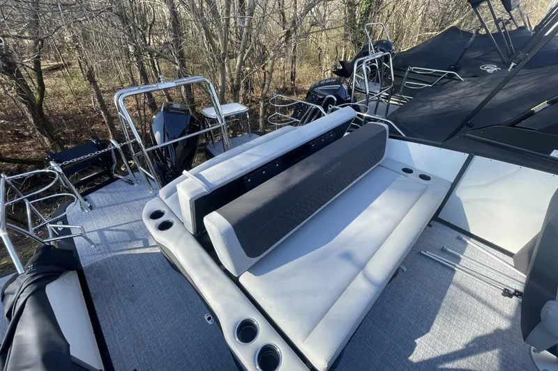 Slide: The Image of 2026 Harris Sunliner 230 pontoon boat interior with seating and cup holders. - 7