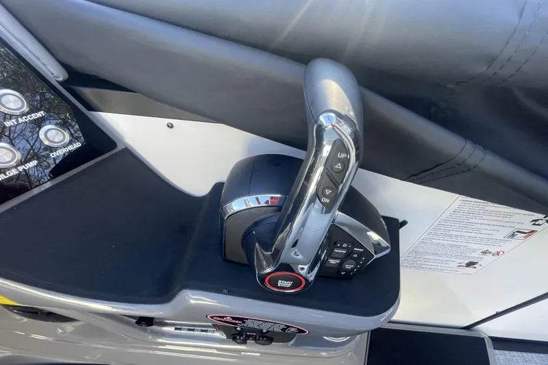 Slide: The Image of Control panel of 2026 Harris Sunliner 230 boat with throttle and buttons. - 8