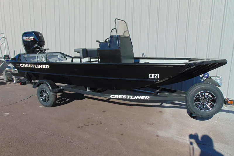 The Image of 2026 Crestliner 1760 Retriever SC boat on trailer, black exterior, side console, Mercury engine. - 1