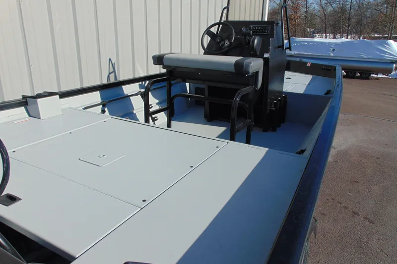 Slide: The Image of 2026 Crestliner 1760 Retriever SC boat interior with steering console and seating. - 7