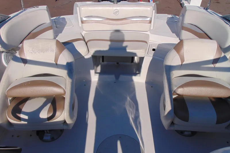 Slide: The Image of 2008 Starcraft 2210 OB Limited boat interior with beige and white seating arrangement. - 15