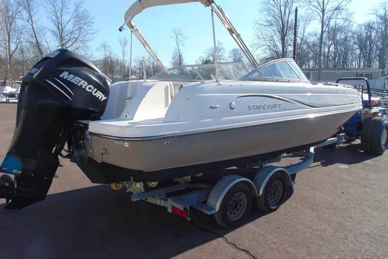 Slide: The Image of 2008 Starcraft 2210 OB Limited boat on trailer with Mercury outboard motor. - 3