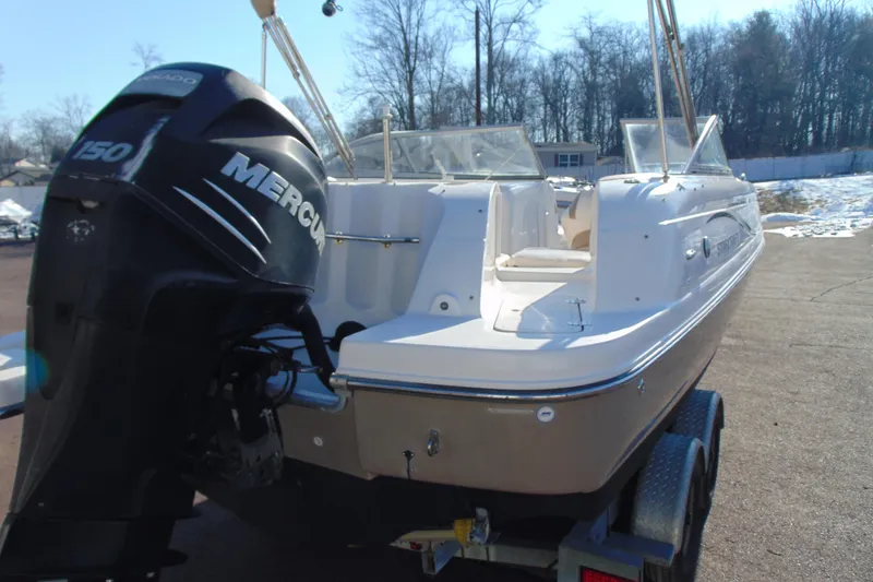 Slide: The Image of 2008 Starcraft 2210 OB Limited boat with Mercury 150 engine on trailer. - 4
