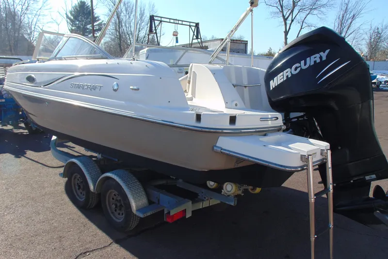 Slide: The Image of 2008 Starcraft 2210 OB Limited boat with Mercury outboard engine on trailer. - 6