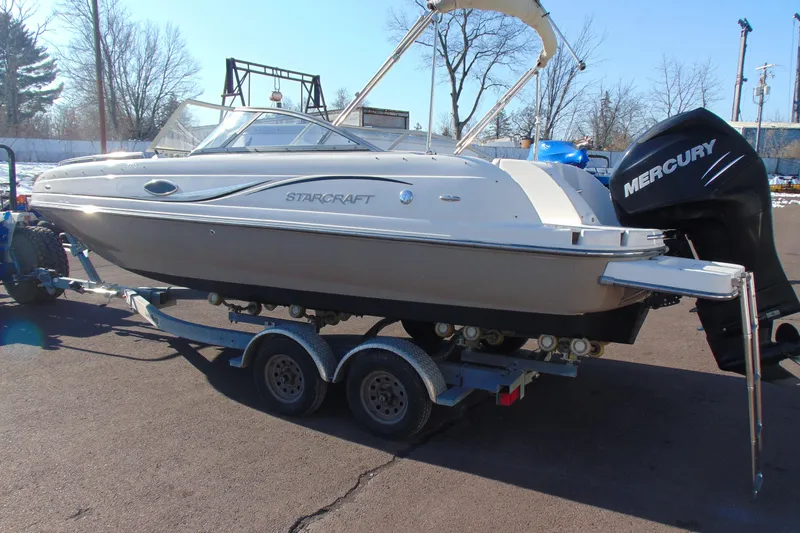 Slide: The Image of 2008 Starcraft 2210 OB Limited boat on trailer with Mercury outboard motor. - 7