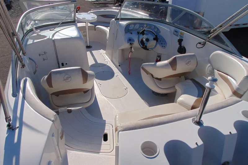 Slide: The Image of 2008 Starcraft 2210 OB Limited boat interior with seating and steering console. - 9