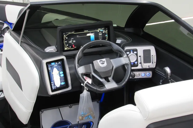 Slide: The Image of 2021 Malibu Wakesetter 23 LSV dashboard with modern controls and touchscreen displays. - 9