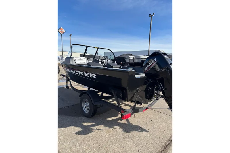 Slide: The Image of 2025 Tracker Pro Guide V-16 WT boat on trailer, featuring Mercury outboard motor. - 4