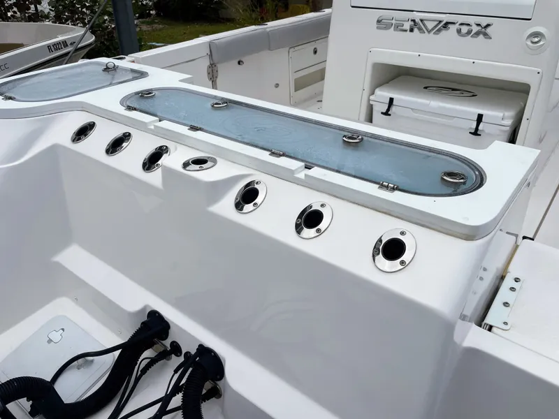 Slide: The Image of Interior of a 2019 Sea Fox 328 Commender boat with fishing rod holders. - 17