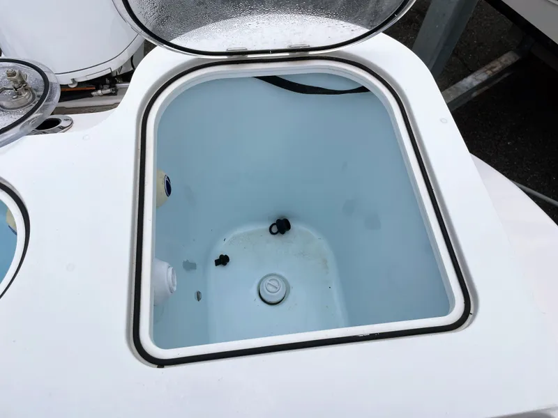 Slide: The Image of Open storage compartment on a 2019 Sea Fox 328 Commender boat. - 25