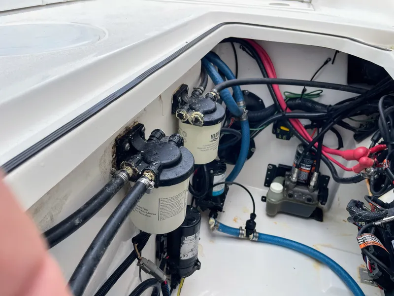 Slide: The Image of Engine compartment of 2019 Sea Fox 328 Commender with hoses and filters. - 33