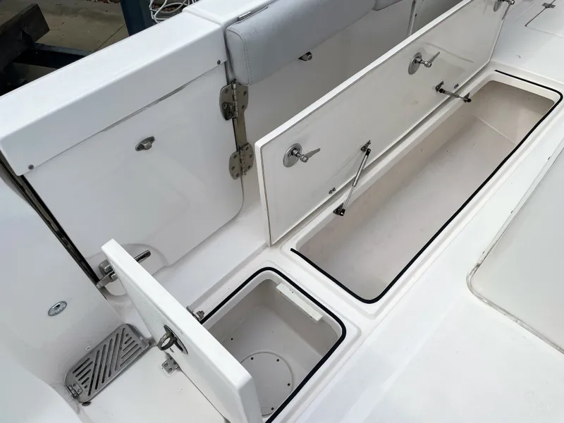 Slide: The Image of Interior view of 2019 Sea Fox 328 Commender boat with storage compartments. - 36