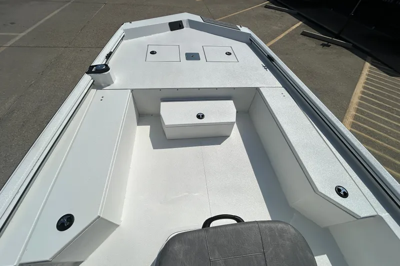 Slide: The Image of Interior view of 2026 Avid 21 Recon boat, showcasing seating and storage compartments. - 12