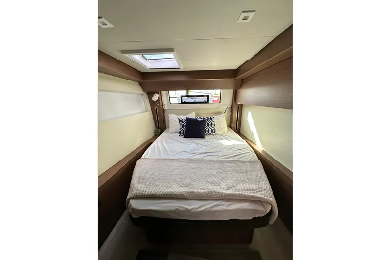 Slide: The Image of Luxurious cabin interior of 2023 Lagoon 50 yacht with cozy bed and skylight. - 29