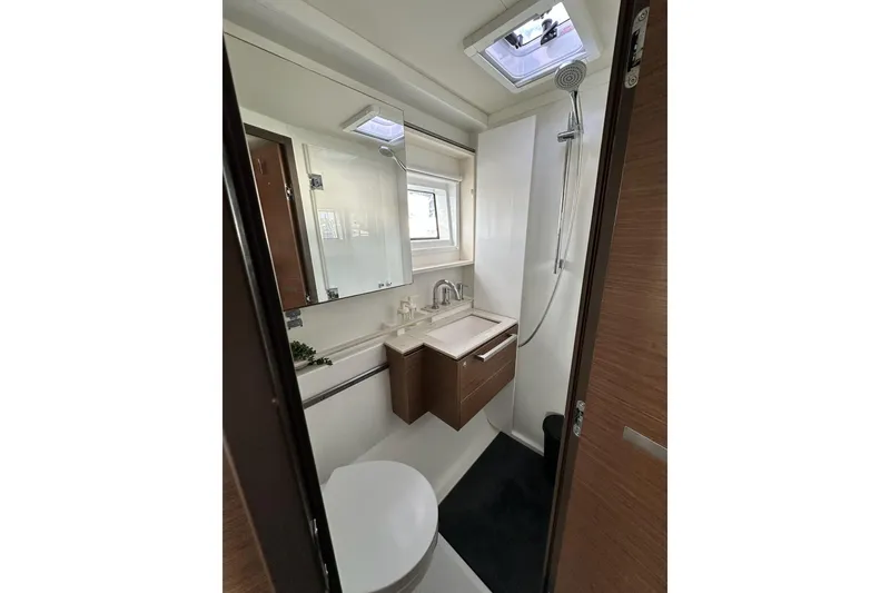Slide: The Image of Modern bathroom in 2023 Lagoon 50 yacht with shower, sink, and mirror. - 33