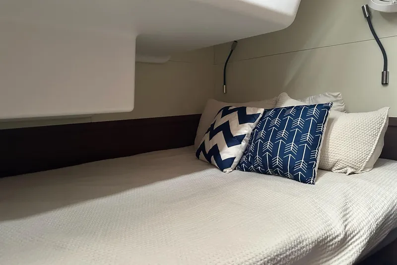 Slide: The Image of Cozy cabin bed with decorative pillows in 2023 Lagoon 50 yacht interior. - 35
