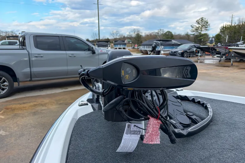 Slide: The Image of 2026 Skeeter ZXE21 boat with advanced trolling motor in a dealership lot. - 13