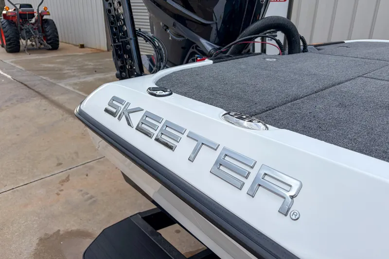 Slide: The Image of 2026 Skeeter ZXE21 boat with sleek design and logo detail. - 8