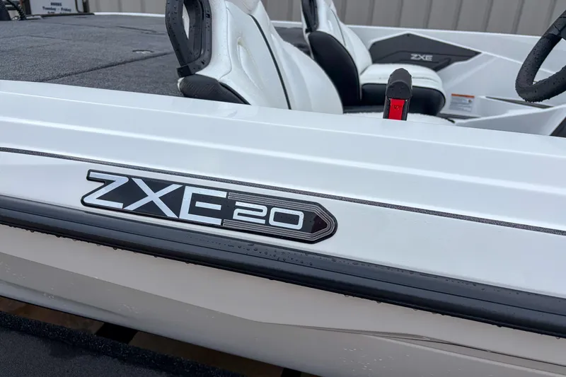 Slide: The Image of 2026 Skeeter ZXE21 boat, white exterior, close-up of ZXE20 model badge. - 9