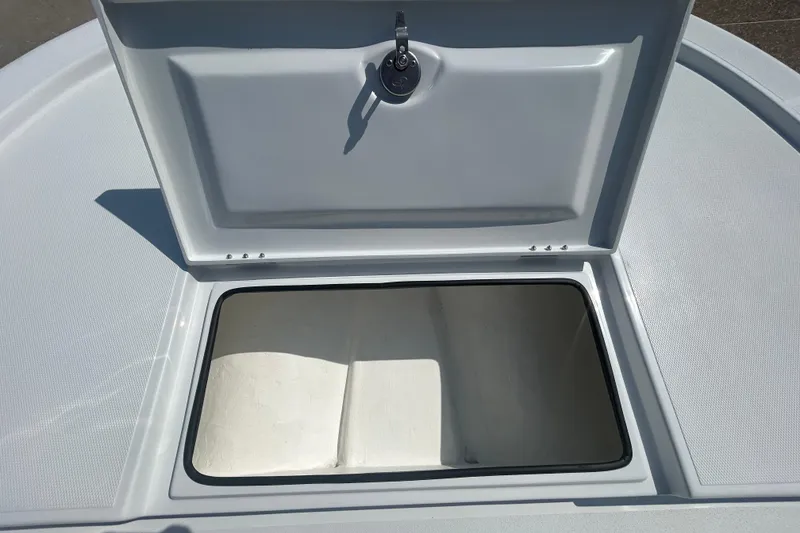 Slide: The Image of Open storage compartment on 2026 Shallow Sport 18 Sport boat deck. - 15