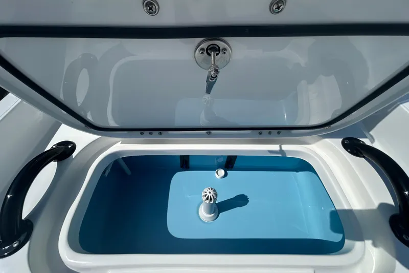 Slide: The Image of Open storage compartment in 2026 Shallow Sport 18 Sport boat. - 17