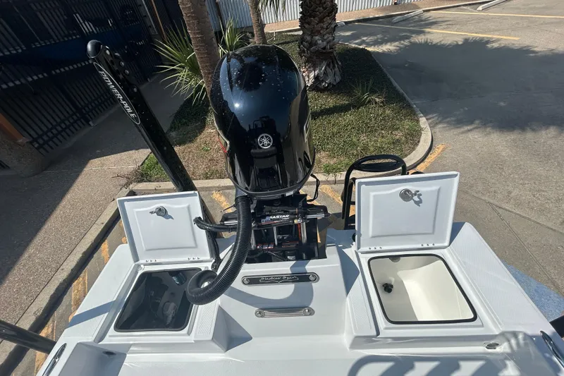 Slide: The Image of 2026 Shallow Sport 18 Sport boat with Yamaha engine and open storage compartments. - 8