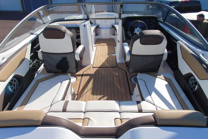 Slide: The Image of 2022 Yamaha Boats 212SE interior with sleek seating and modern dashboard design. - 7